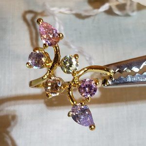 Pastel stones? glass? crystals? ring set in gold-tone setting, size 9